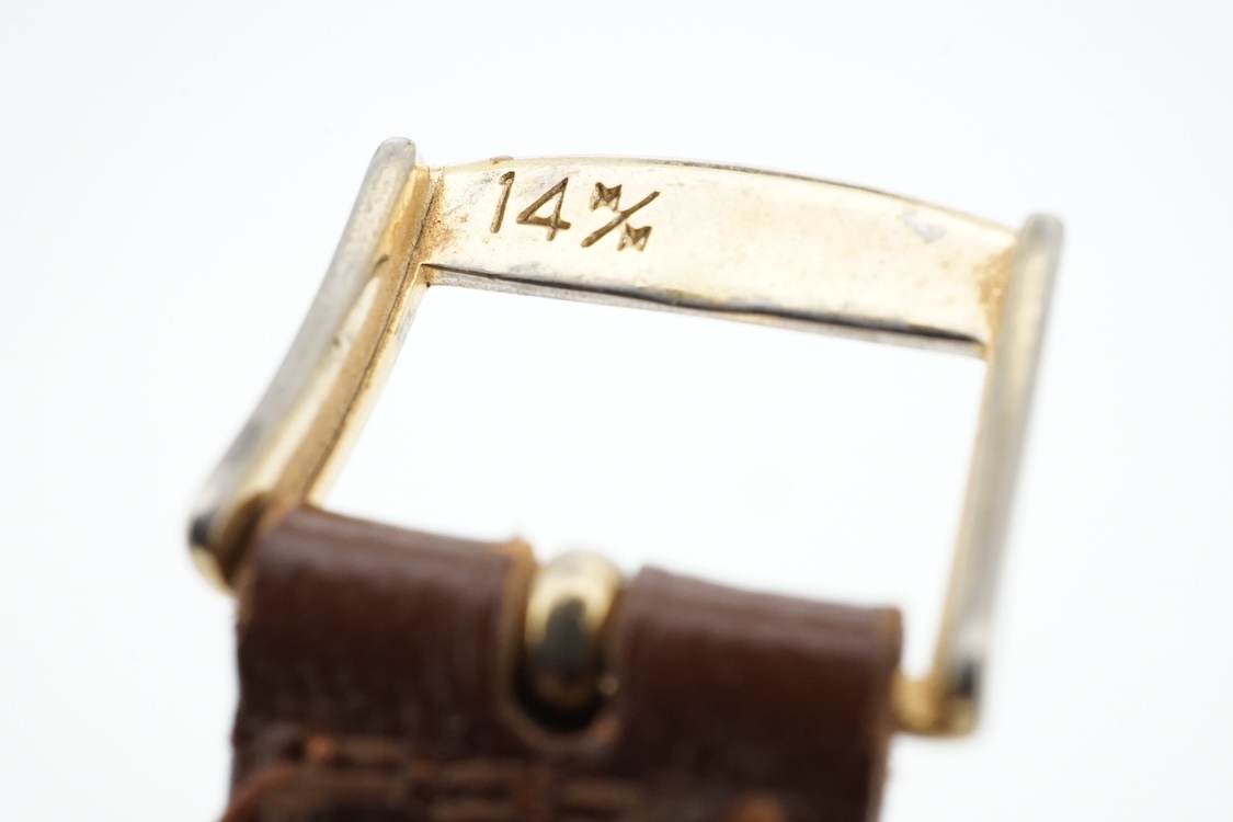 A 1950's 9ct gold Tudor Royal manual wind wrist watch, with Arabic dial, case diameter 27mm, with case back inscription, on a later associated strap.